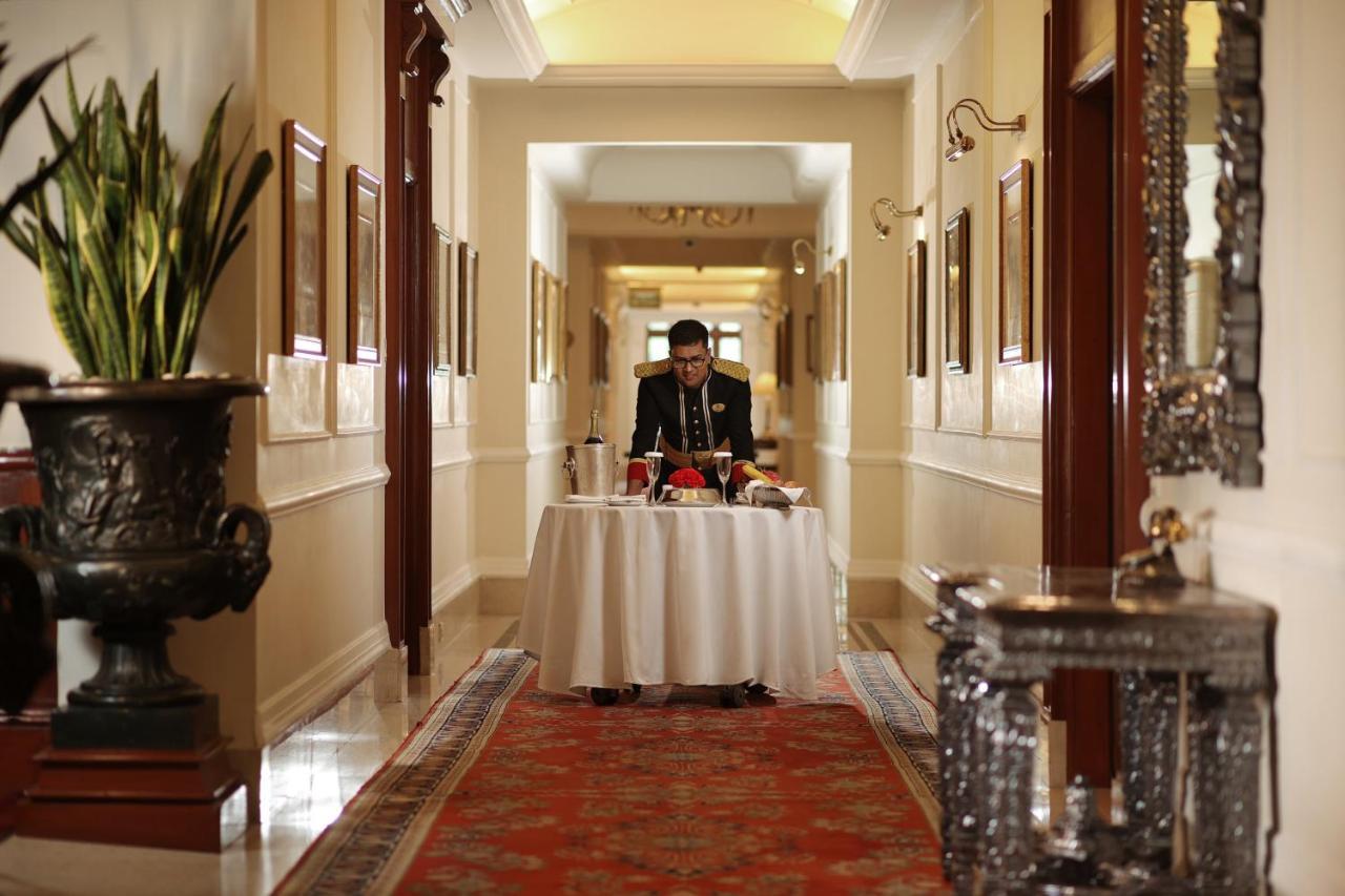 The Imperial, New Delhi Hotel Exterior photo A butler at the Taj Mahal Palace, Mumbai, India