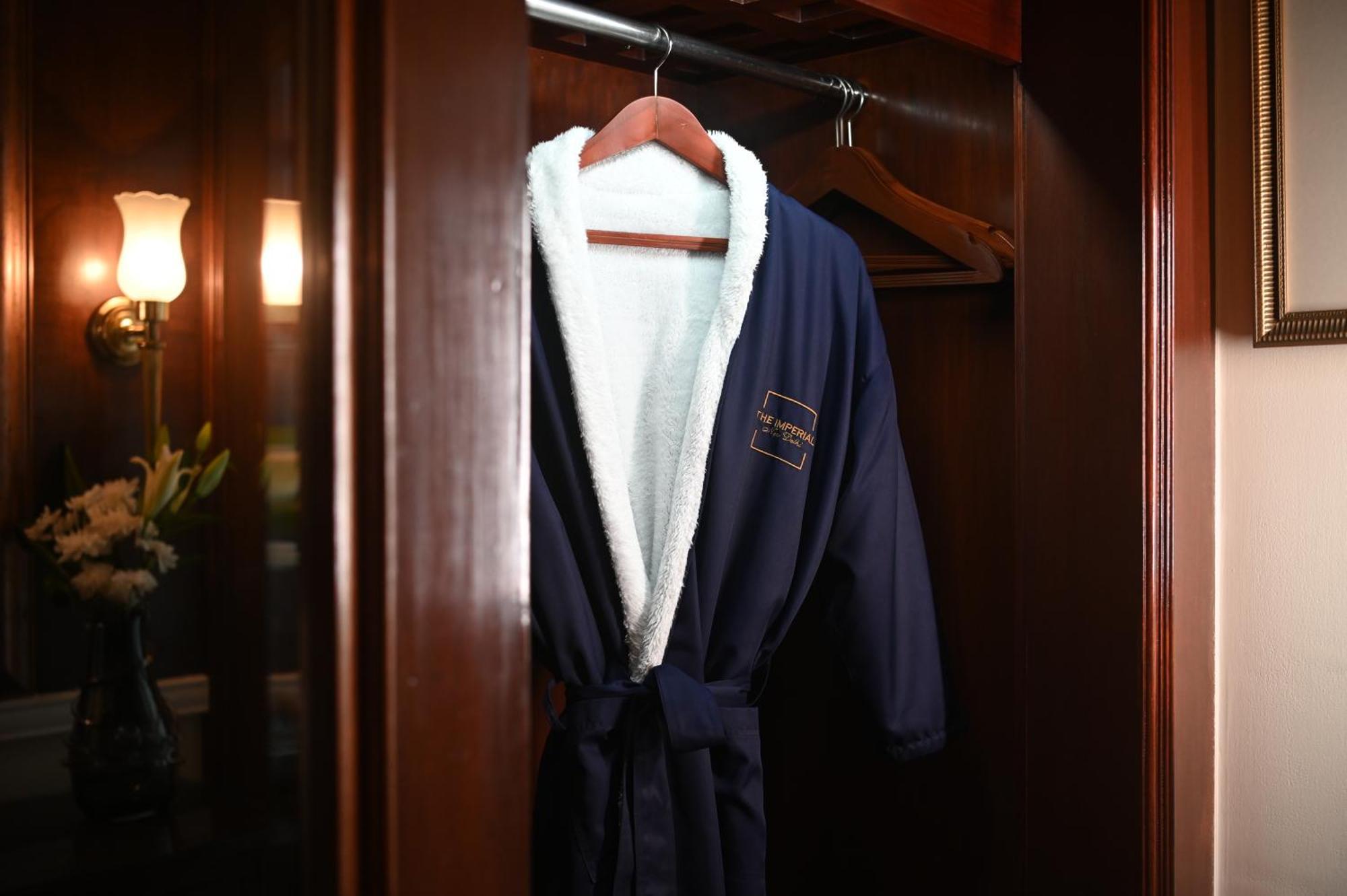 The Imperial, New Delhi Hotel Exterior photo A bathrobe hanging on a door