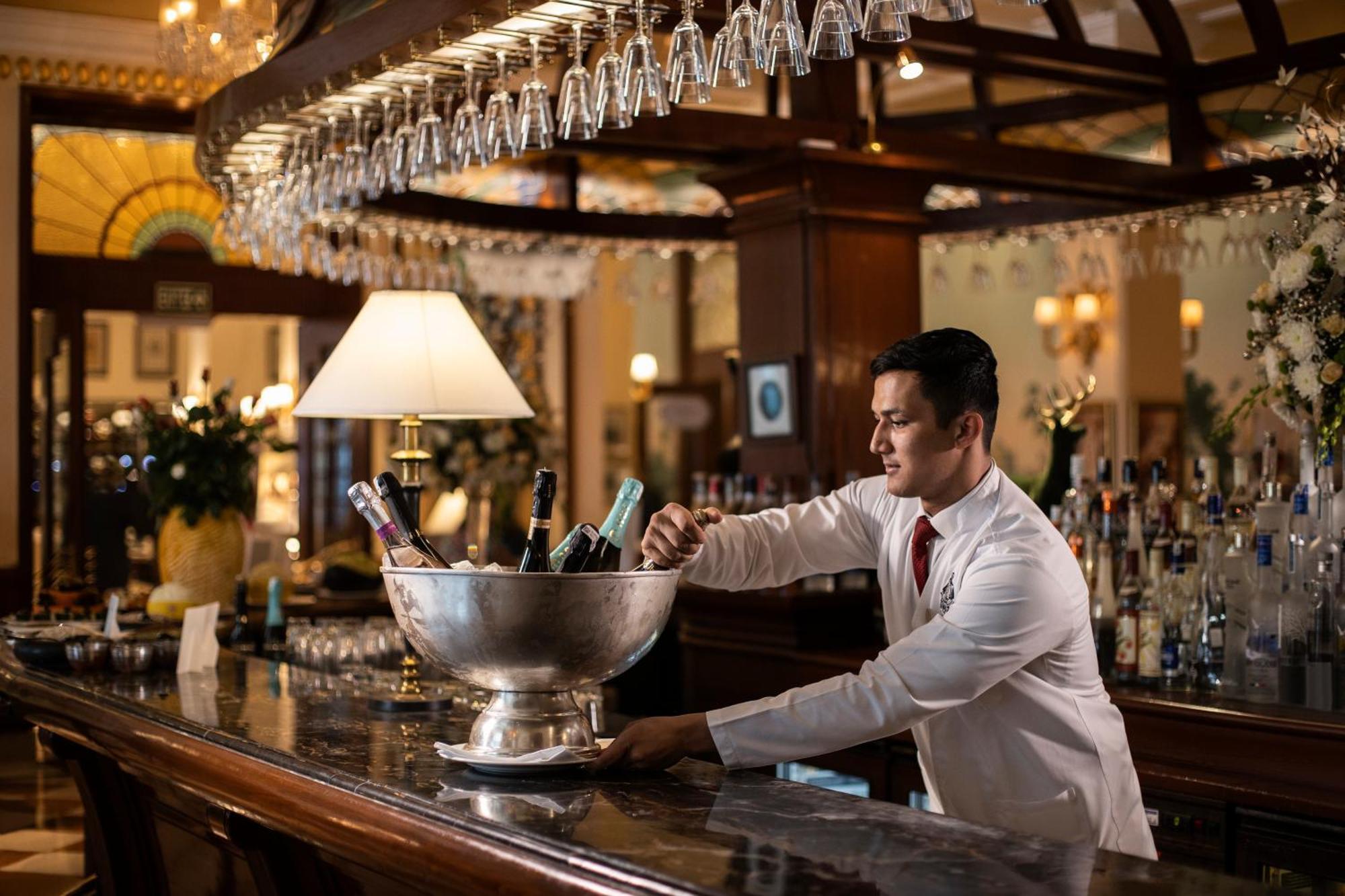 The Imperial, New Delhi Hotel Exterior photo A bartender at work
